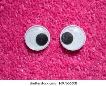 Funny Wiggle Google Eyes On Fabric Silly Pink Fur Carpet Background