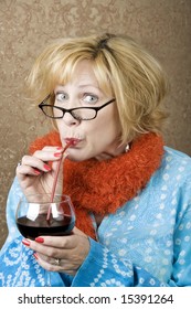Funny Woman Drinking Wine Through A Straw