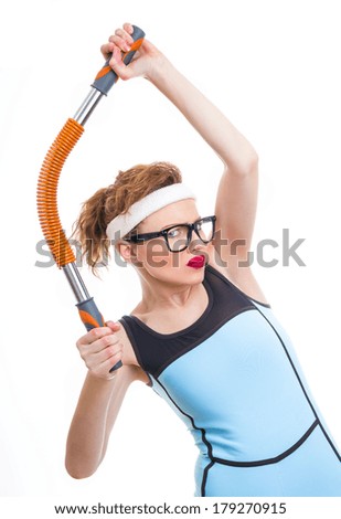 Funny woman with expander, fitness girl over white background