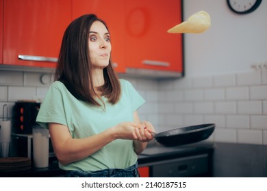 
Funny Woman Flipping Pancakes in the Kitchen. Home cook making breakfast testing crepe tossing skills in the morning
 - Powered by Shutterstock