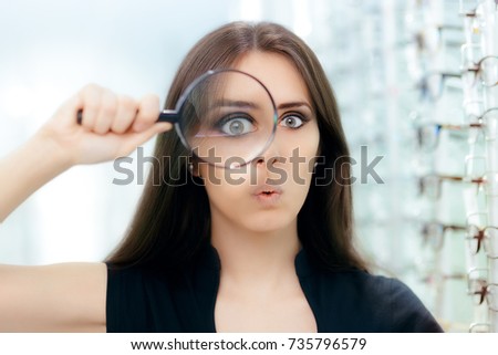 Funny Woman with Magnifying Glass Ready For Eye Exam - Curious girl looking for the perfect pair of glasses
