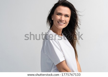 Funny woman on white background. Cheerful female model joyful. Positive human emotion facial expression body language