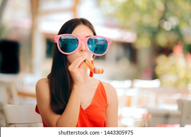Funny Woman with Party Horn Blower and Oversized Sunglasses. Eccentric exuberant girl blowing a whistle at birthday party
 - Shutterstock ID 1443305975