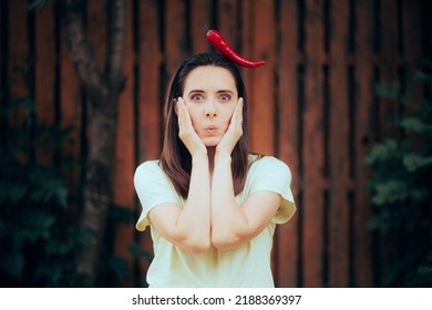 Funny Woman Reacting After Eating Spicy Foods. Cheerful Party Girl Wearing A Pepper On Her Head
