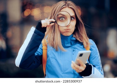 
Funny Woman Searching the Internet on her mobile Phone. Girl checking her date on social media stalking his private life 
