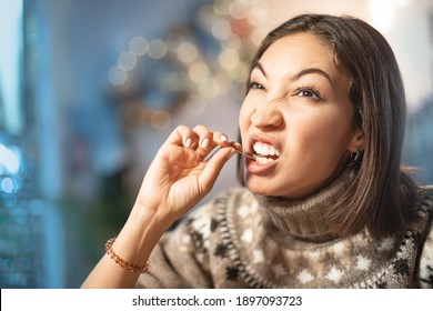 Funny Woman Smiles, Winks And Picks Her Teeth With A Toothpick On A First Date. Concept Of Bad Manners And Bad Habits, As Well As Dental Health