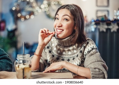 Funny Woman Smiles, Winks And Picks Her Teeth With A Toothpick On A First Date. Concept Of Bad Manners And Bad Habits, As Well As Dental Health