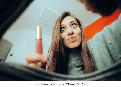 
Funny Woman Taking out her Lips gloss from her Bag. Stressed girl checking her makeup bag for something
