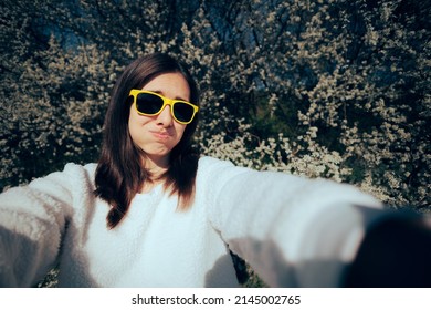 
Funny Woman Trying To Take A Selfie Outdoors In Nature. Awkward Girl Feeling Silly Trying To Take A Picture During Springtime
