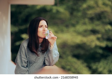 
Funny Woman Unhappy With Water Quality And Smell
Disgusted Person Having A Glass Of Contaminated Tap Water
