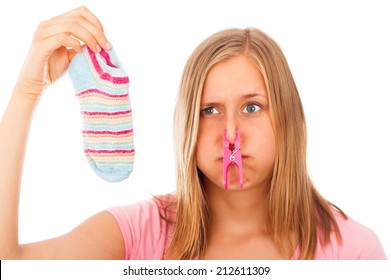 Funny Woman Wearing Clothe Pin On Her Nose Because Of Bad Smell.