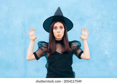 Funny Woman Wearing Witch Costume Trying To Look Scary. Halloween Lady Joking With Jump Scare Prank Making Silly Boo Sounds
