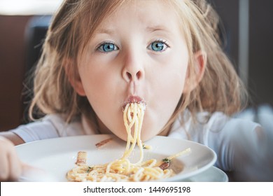 Funny Young Girl Eating Pasta