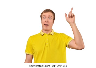 Funny young guy in yellow T-shirt with eureka gesture, man got idea, isolated on white background. Surprised man pointing index finger up, found solution to work task, remembered forgotten thought