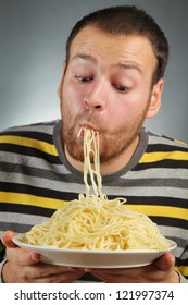 Funny Young Man Eating Pasta