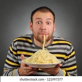 Funny Young Man Eating Pasta