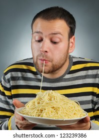 Funny Young Man Eating Pasta