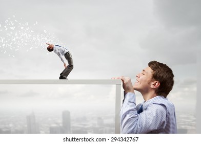 Funny Young Man Looking From Under Table