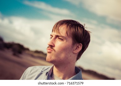 Funny Young Man Making Goofy Faces 
