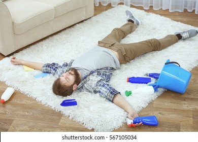 Funny Young Man Tired Of Cleaning Carpet At Home