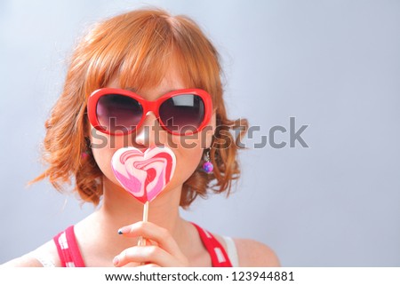 funny young woman with lollipop