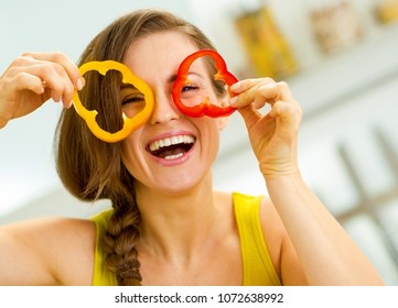 Funny Young Woman Showing Slices Of Bell Pepper