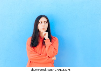 Funny Young Woman Thinking Making A Plan. Pensive Witty Girl Having A Clever Idea
