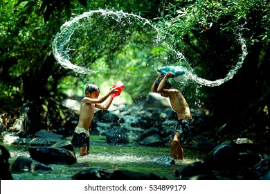 Fun,Two Children Play The Water, Enjoy The Bold.enjoying Daring 