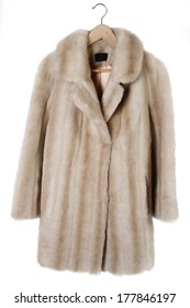 Fur Coat On Hanger Isolated On Plain Background