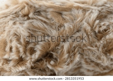 Fur none, in close-up view of fur texture, with fur, from a close-up perspective perspective, with beige, brown accents, and neutral mood, showing nearby objects and surrounding setting.