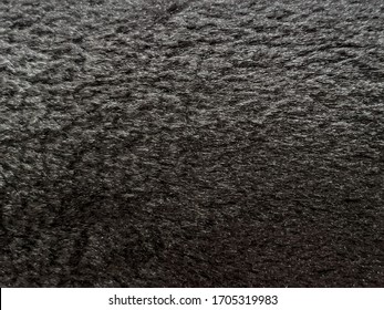 Fur texture. Fur fabric. Black material. - Shutterstock ID 1705319983
