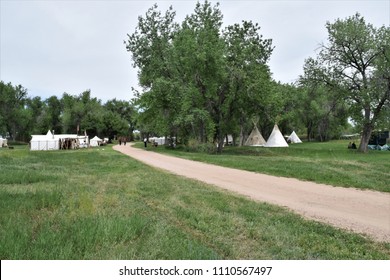 Fur Trapper Camp Reenactment.  White Tents And Tepees.  