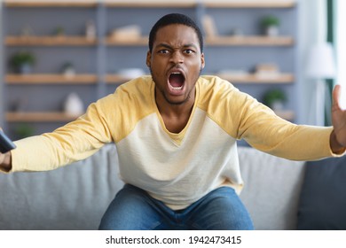Furious Black Guy Watching Football Game On TV