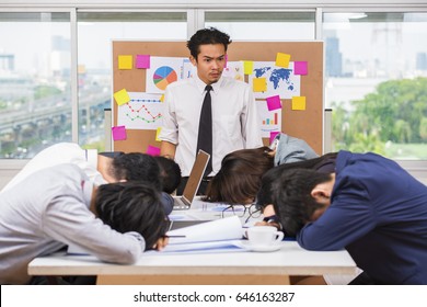 Furious Boss Scolding Frustrated Interns With Bad Work Results And Bored Businessman In Conference Meeting. Selective Focus