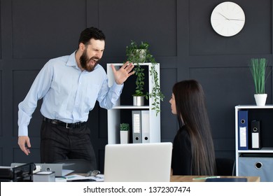 Furious businessman shout at female employee working in shared office, mad male boss scream at guilty intern, blaming for mistake, CEO accuse woman worker in company failure or bad results  - Shutterstock ID 1372307474