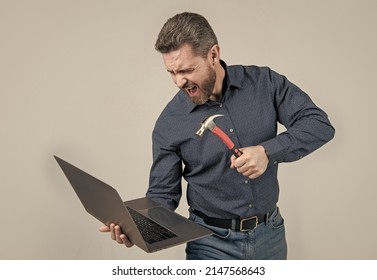 Furious Man Break Laptop Hitting Notebook With Hammer Grey Background, Computer Rage