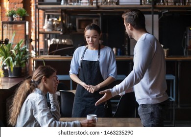 Furious Man Stand Dispute With Guilty Waitress Bringing Wrong Order, Mad Client Couple Get Nervous Disappointed With Bad Service Or Waiter Incompetence, Blame Stuff Yell And Shout In Public Place