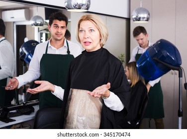 Furious Senior Woman Screaming On Hairstylist As Hair Cut Badly