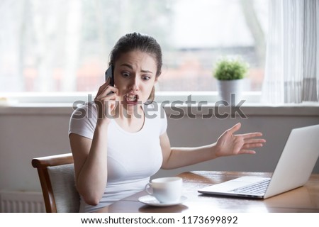 Furious woman argue talking on phone having problems with boyfriend or lover, mad female call customer support have problems with laptop, angry girl scream during emotional conversation over phone