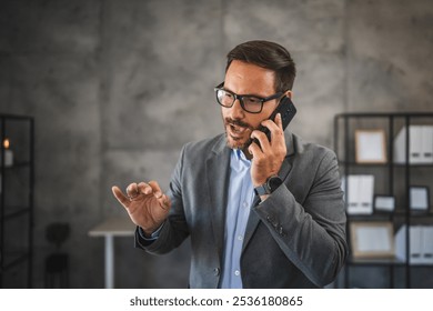 furious and worried businessman have a phone call with a bad news in modern office - Powered by Shutterstock