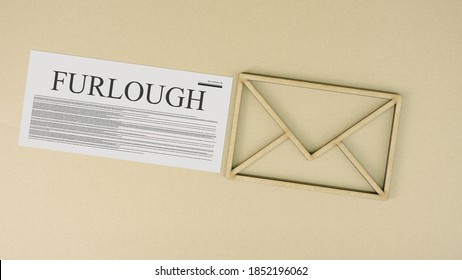 Furlough Papers And The Envelope Icon On The Table