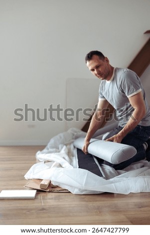 The furniture assembler assembles the bed frame, do it yourself and assemble new furniture