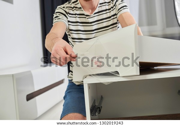 Furniture Assembler Joins Together Two Parts Stock Photo Edit Now