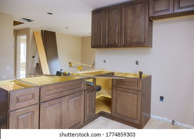 Furniture Assembling Of Custom New Cabinets In Modern Kitchen