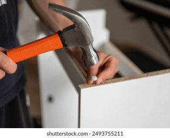 Furniture Assembly Manual. Workman Reading Instruction Installing Cabinet Making House Renovation Indoors. - Powered by Shutterstock