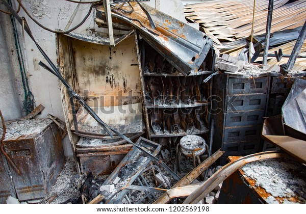 Furniture of a factory damaged by fire / Damage\
caused by fire - Burnt\
interior