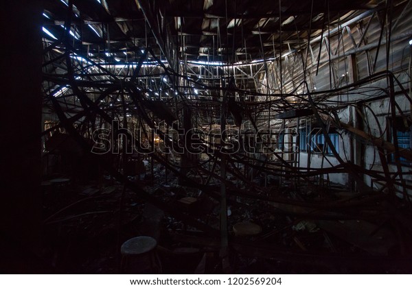Furniture of a factory damaged by fire / Damage\
caused by fire - Burnt\
interior
