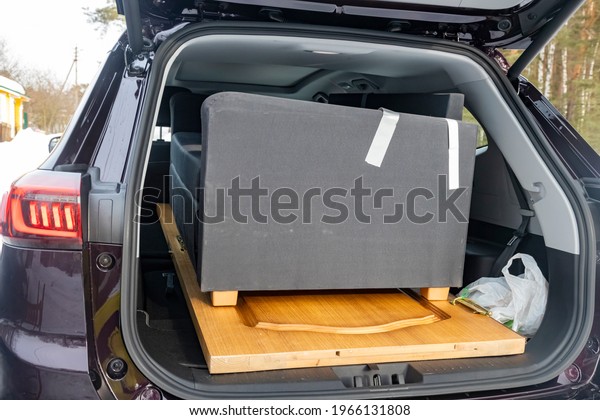 furniture in the passenger car. SUV large trunk\
volume. no people. close\
up.