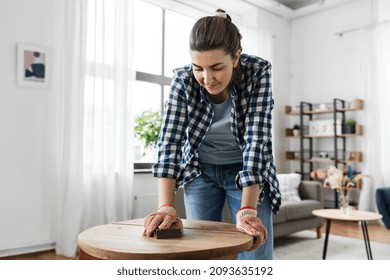 Furniture Renovation, Diy And Home Improvement Concept - Happy Smiling Woman Sanding Old Wooden Table With Sponge