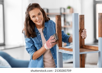 Furniture Renovation, Diy And Home Improvement Concept - Happy Smiling Woman Sanding Old Wooden Table Or Chair With Sponge